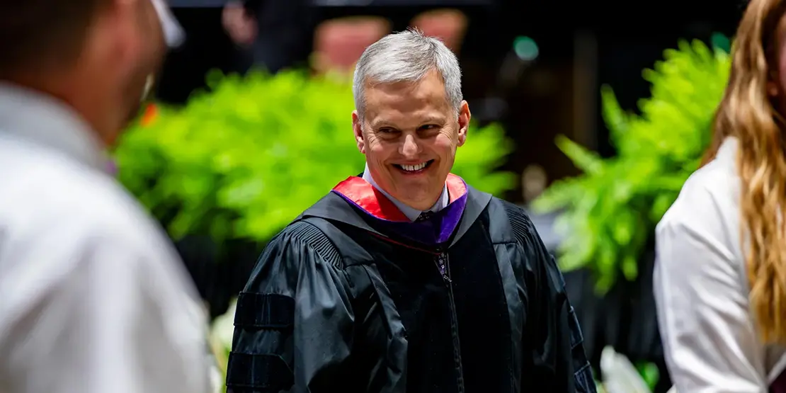 Gov. Josh Stein makes his way to the stage inside Harrah's Cherokee Center during A-B Tech's graduation ceremony, May 10, 2025, in Asheville.