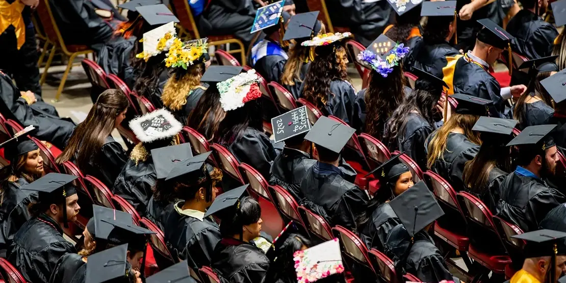 A-B Tech graduates sit inside Harrah's Cherokee Center during the university's graduation ceremony, May 10, 2025, in Asheville.