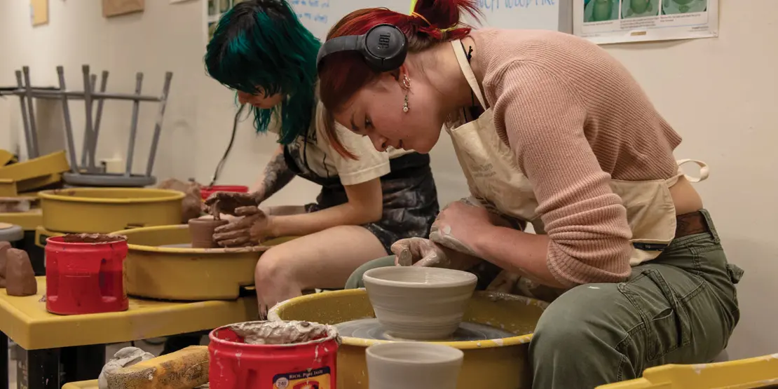 Students creating pottery