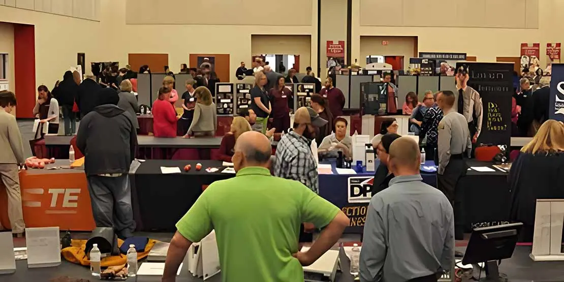 View of rows of booths at Find Your Future Open House