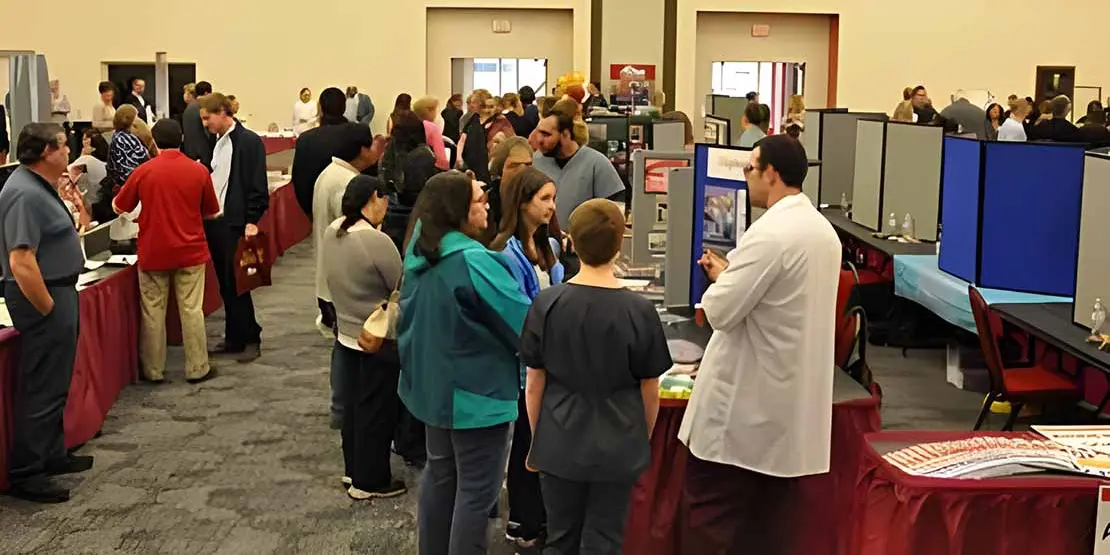 Booths and people at the Find Your Future Open House
