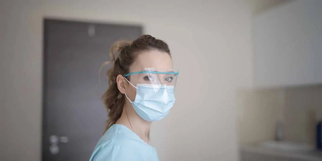 Woman wearing a mask and safety glasses