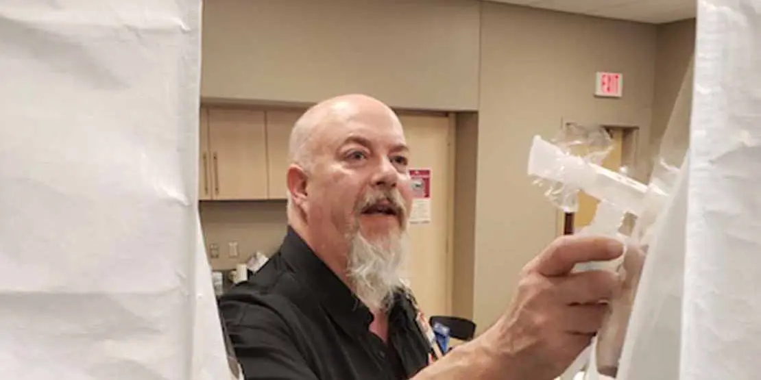 Anthony Green fitting face masks