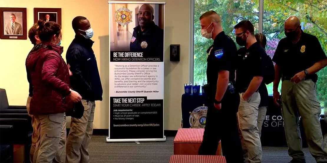 Law enforcement officers standing in lobby