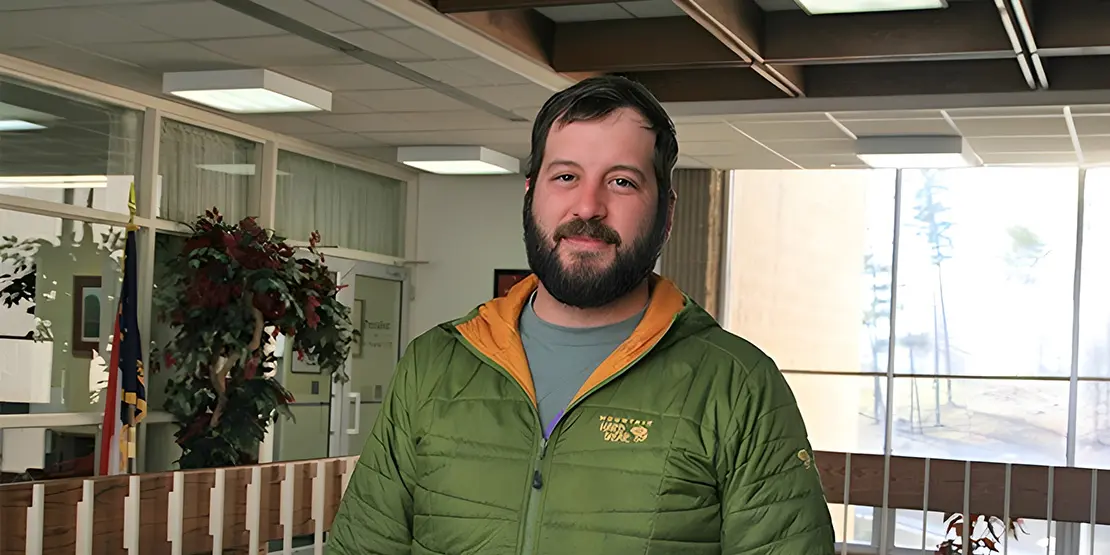 Nick Long standing in hallway