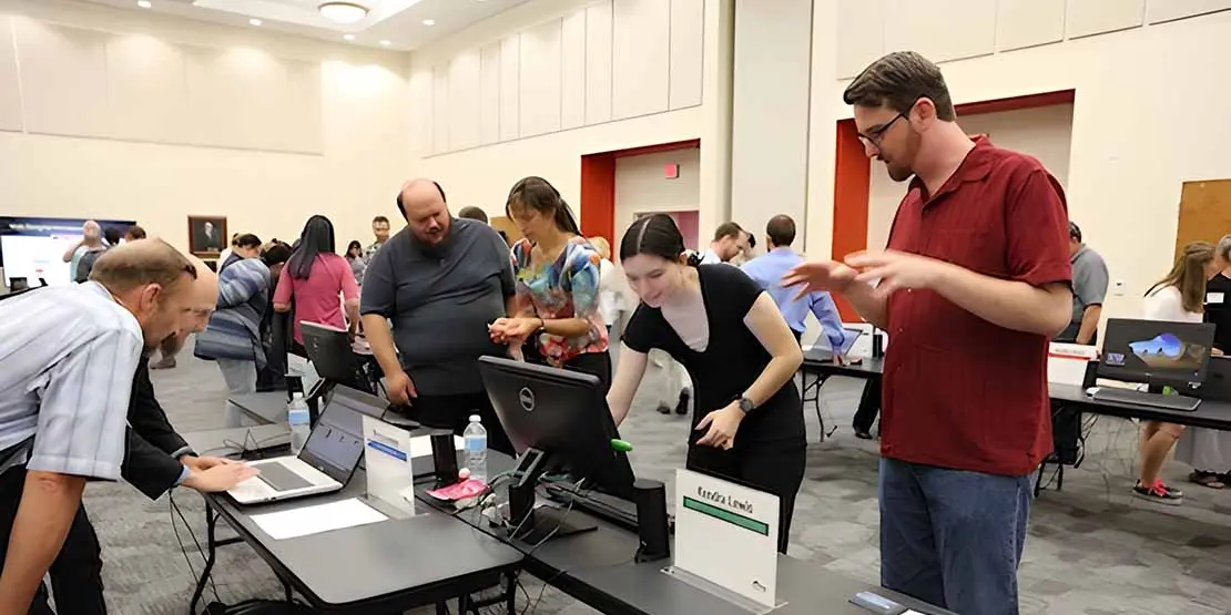 Students looking at a computer