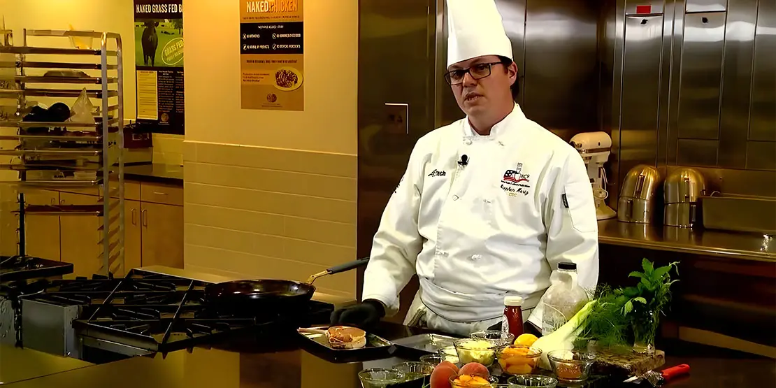Chef standing behind a counter
