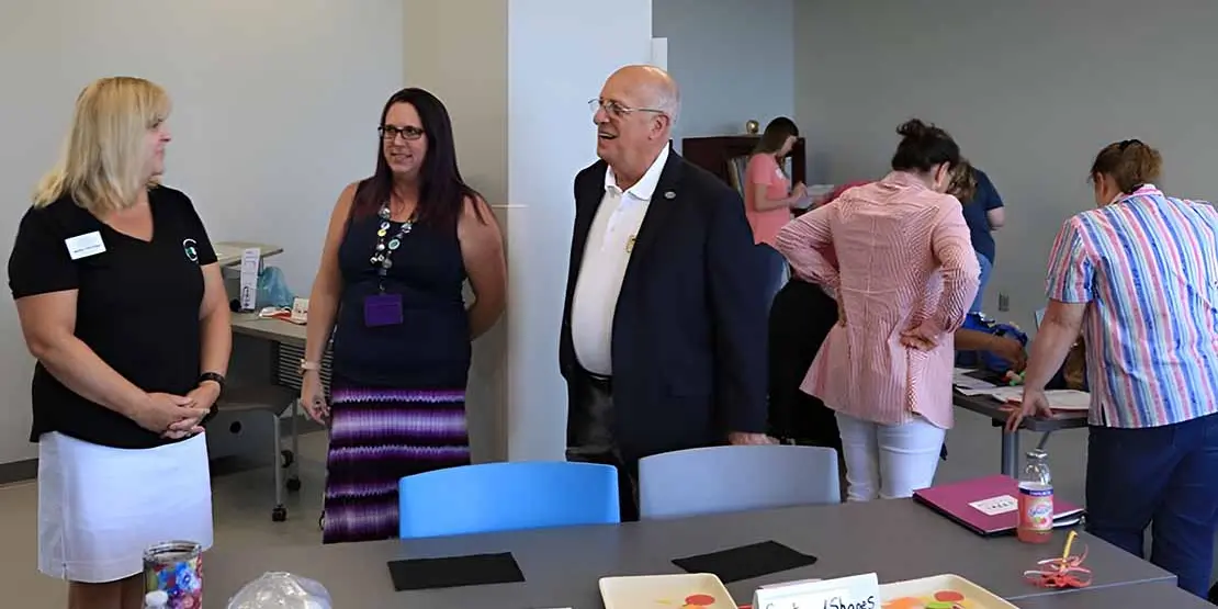 Dr. King talking to some teachers in the Early Childhood program