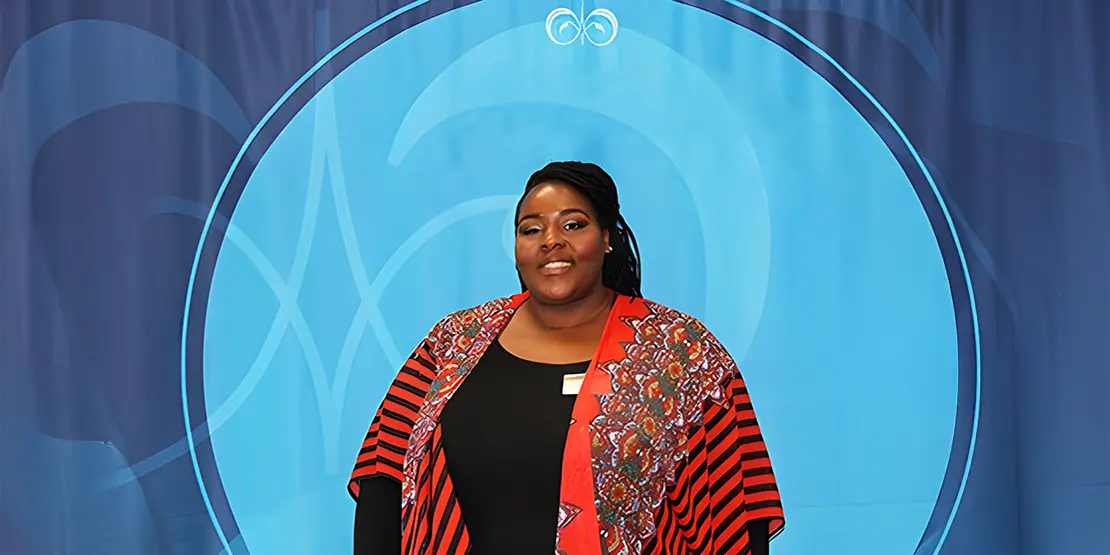 Marshay Proctor-Bates in front of blue background