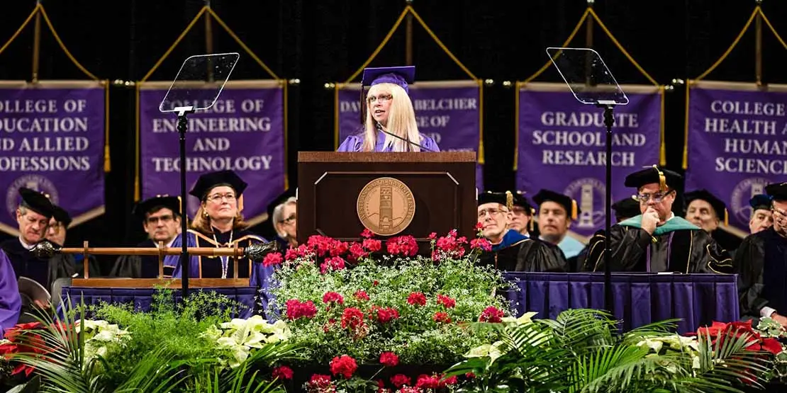 Mary Lewis at lectern