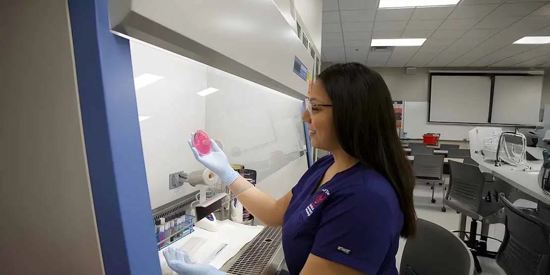 Med Lab Student with petri dish