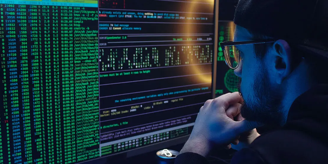 Man in front of computer screen