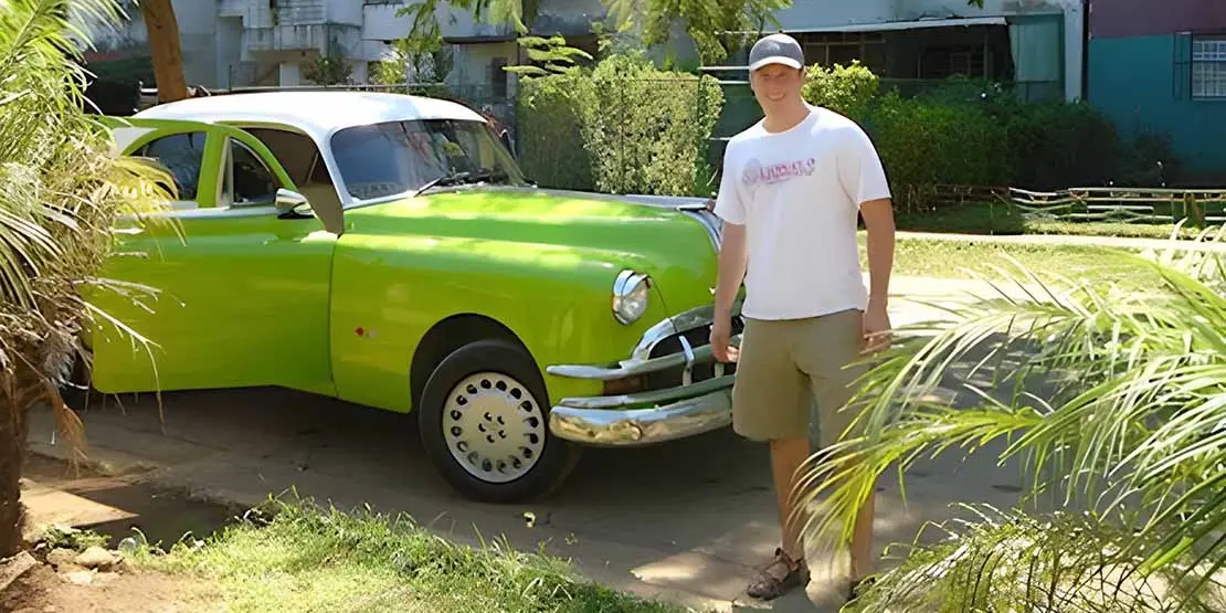 Man and green car