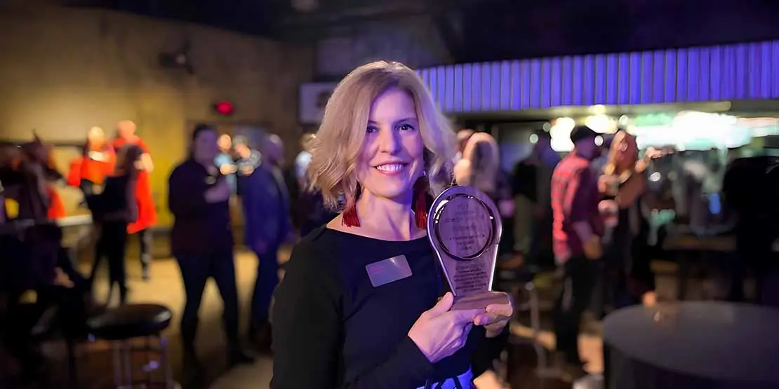 Jill Sparks holding Vanguard award