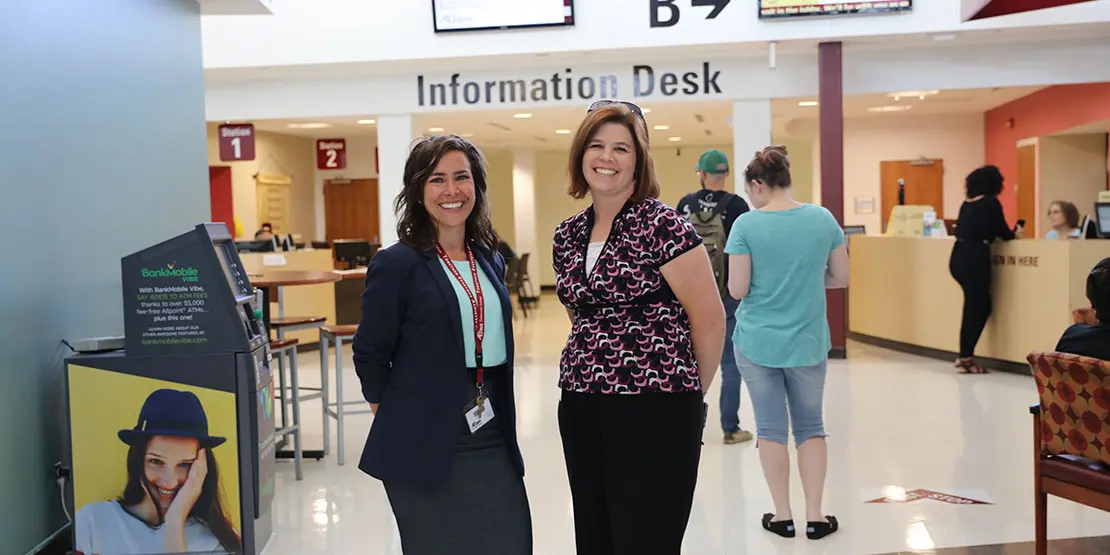 Jenna Deal and Heather Pack standing in the lobby of the Bailey Building.