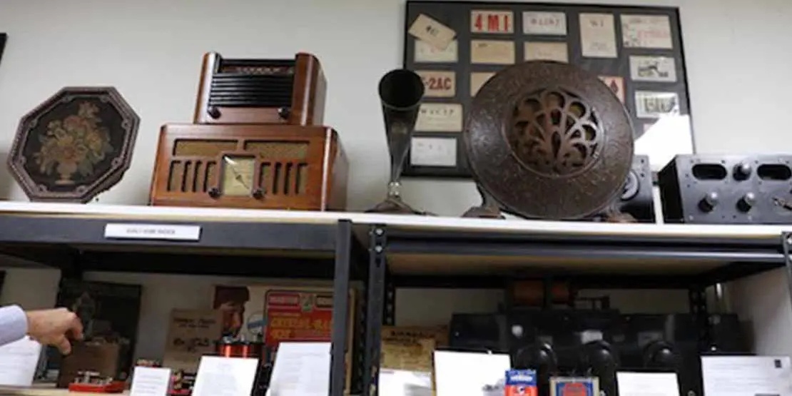 Antique radios on shelves