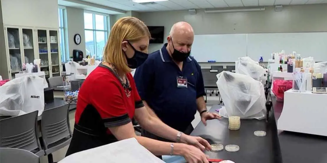 Dr. Wiener and Jennifer Emert from WLOS testing masks