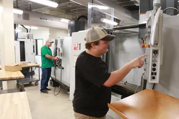 Men working CNC Machines