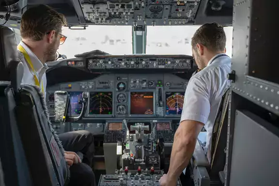 pilot and co-pilot in cockpit of airplane