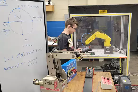 Student Using Robot Arm
