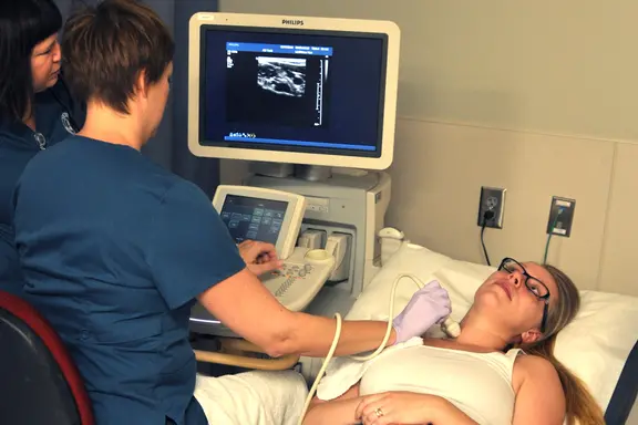 Cardiovascular Sonography students using equipment