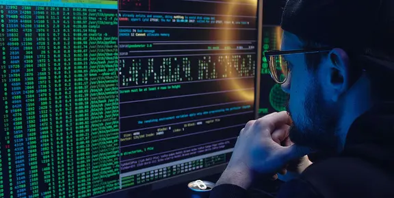 Man in front of computer screen