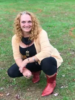 Woman Kneeling in Grass