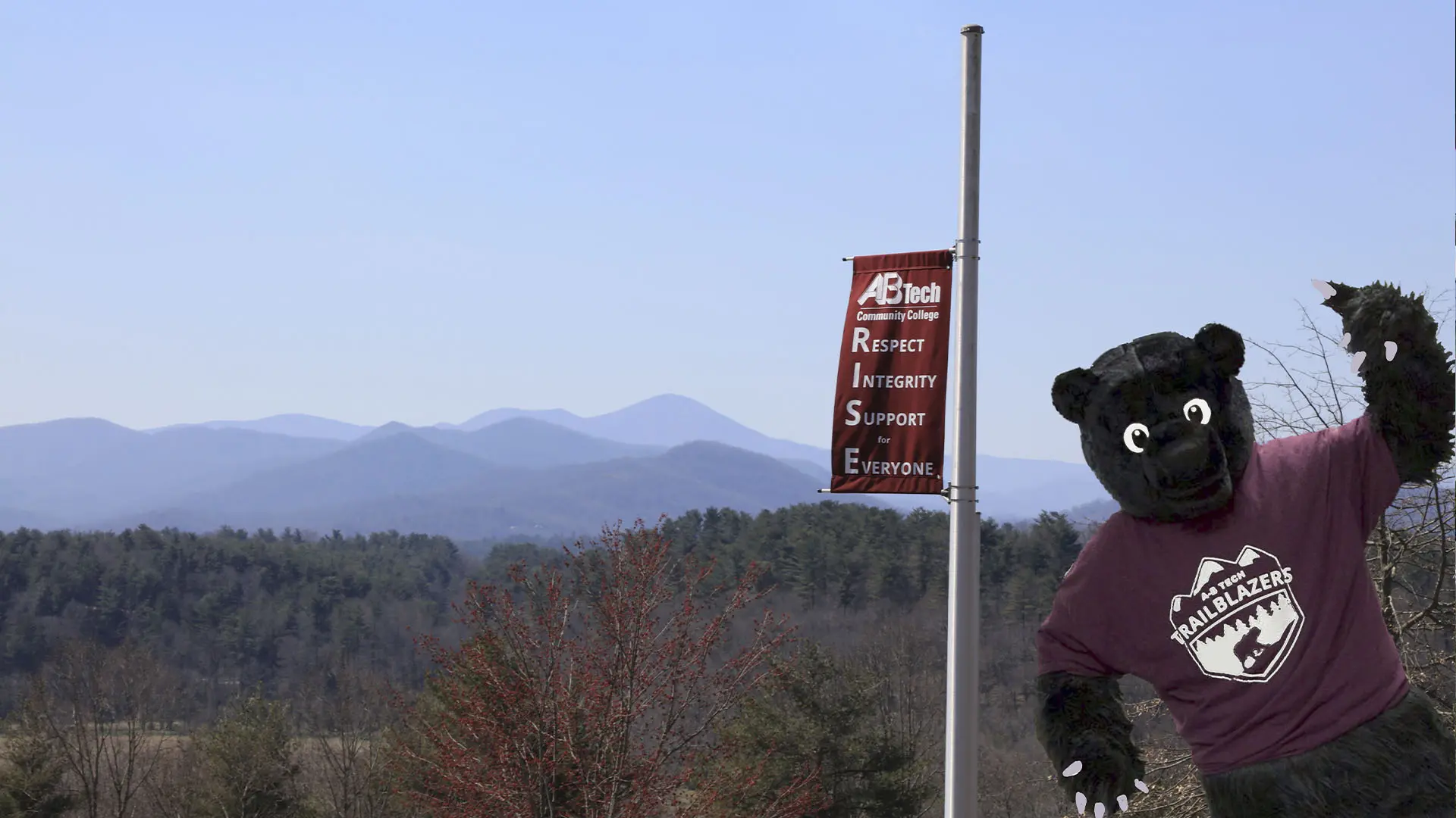 Trailblazer bear photobombs photo of mountain view