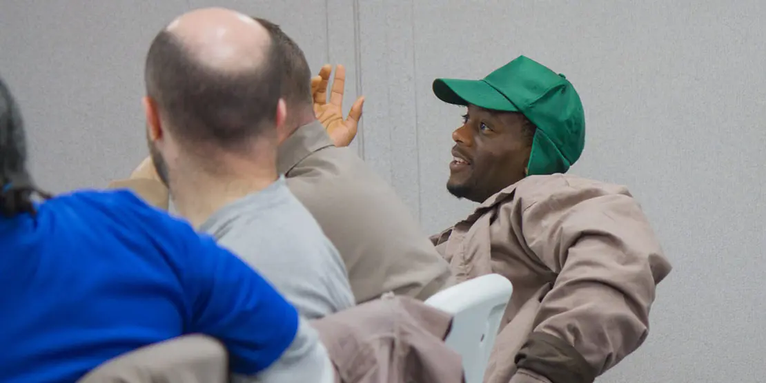 A student raises his hand at Nash Correctional Institution. Ben Humphries/EdNC