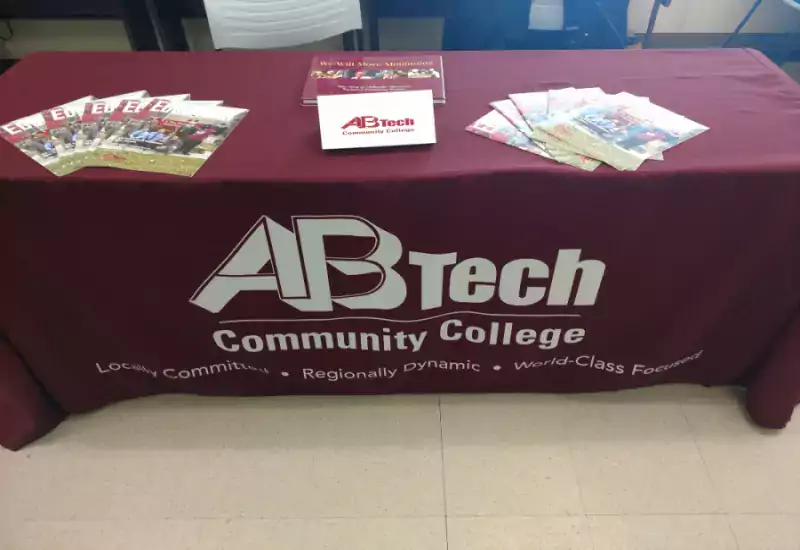 Hiring and onboarding table at job fair