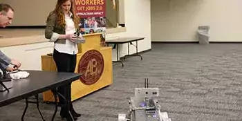 Camille Beatty with a robot. 