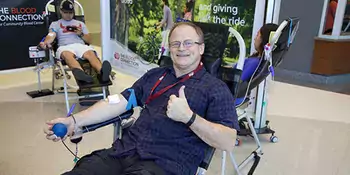 Donald Perkins giving blood at Blood Drive