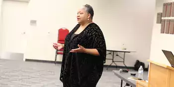 Jacqueline Whittenburg standing in front of room