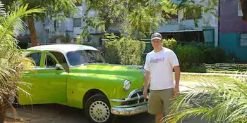 Man and green car