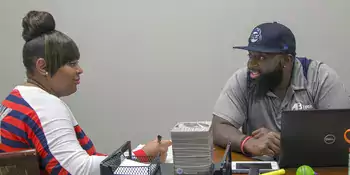 Philip Cooper and Michelle Hurst sitting at a table