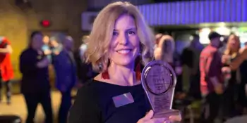 Jill Sparks holding Vanguard award