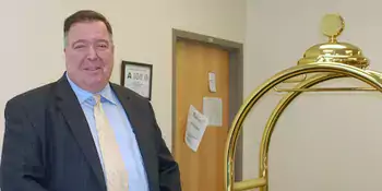 Walter Rapetski standing behind a desk