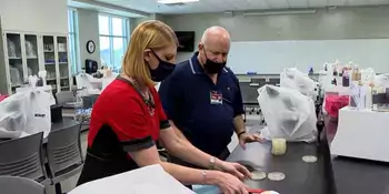 Dr. Wiener and Jennifer Emert from WLOS testing masks