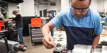 Man working with electric motor