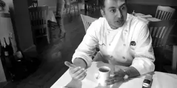 Chef Setayesh sitting at a table