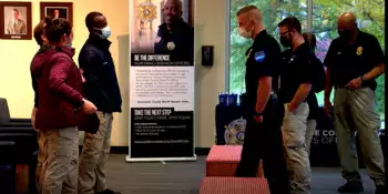 Law enforcement officers standing in lobby