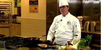 Chef standing behind a counter