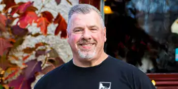 Smiling man wearing black shirt