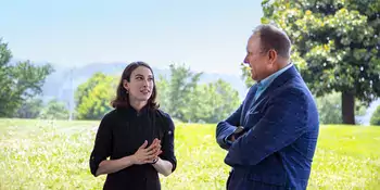 The region’s first culinary apprentice, Caitlyn Wright of Asheville, accepts congratulations from A-B Tech President John Gossett. Photo courtesy of A-