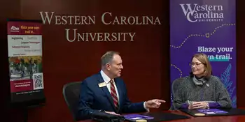 John Gossett, president of Asheville-Buncombe Technical Community College, and WCU Chancellor Kelli Brown signing an memorandum of understanding renewal between the two institutions.