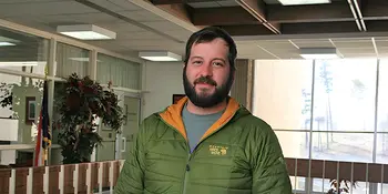 Nick Long standing in hallway