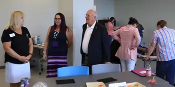 Dr. King talking to some teachers in the Early Childhood program