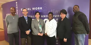 Six men and women standing together