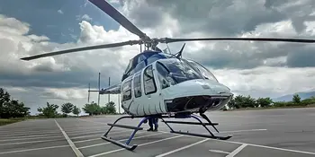 Helicopter on asphalt parking lot