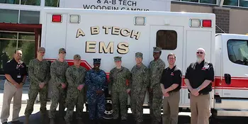 10 men and women standing in front of A-B Tech ambulance